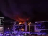 A view shows the burning Crocus City Hall concert hall following the shooting incident in Krasnogorsk, outside Moscow, on March 22, 2024