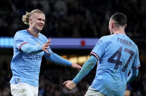 Erling Haaland from Manchester City celebrates the scoring of the third goal alongside his teammate Phil Foden in the Premier League encounter between Manchester City and Manchester United at Etihad Stadium.