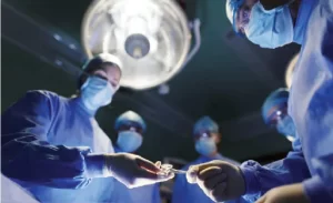 Surgeons conducting surgical operation