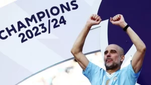 Manchester City manager Pep Guardiola celebrates a 4th successive title