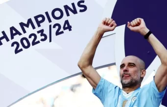 Manchester City manager Pep Guardiola celebrates a 4th successive title